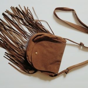 Tan fringe saddle bag